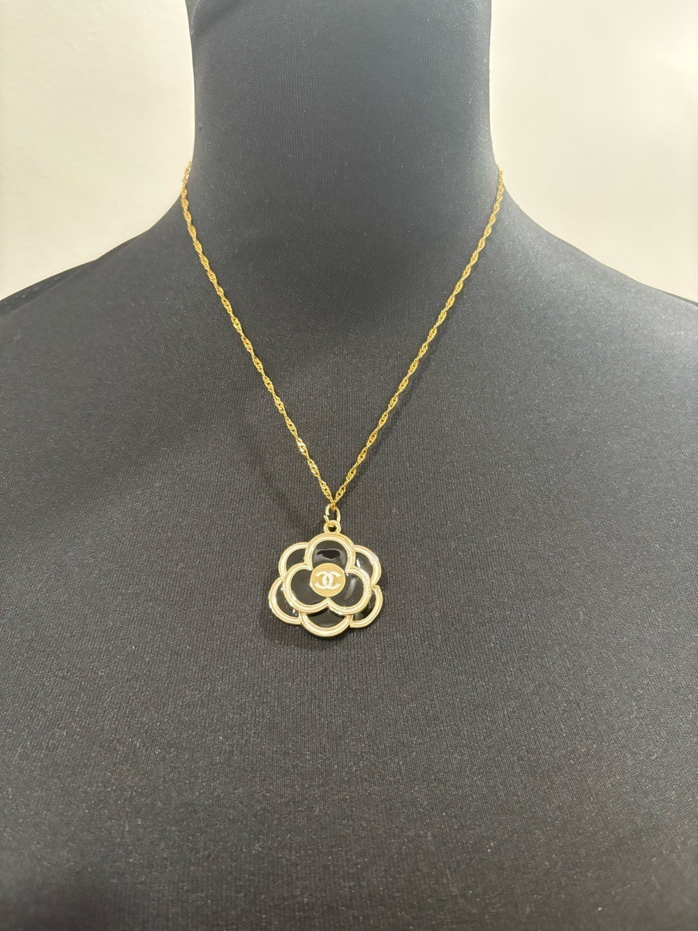 831. Black and Gold Camellia Pendant